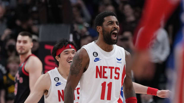 Kyrie Irving celebrates a game-winning shot.